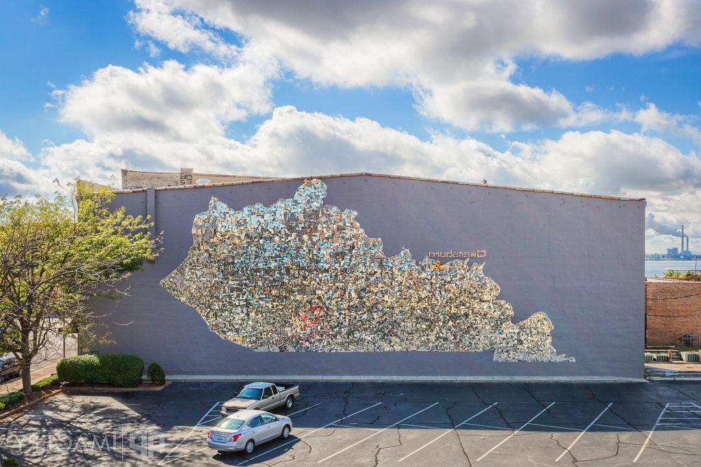 Mirrored image in the shape of Kentucky on the side of a building